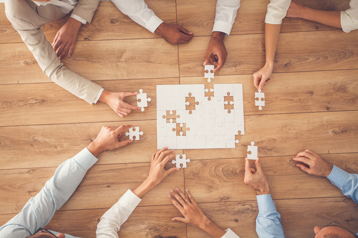 Business people finding solution together at office Business people finding solution together at office