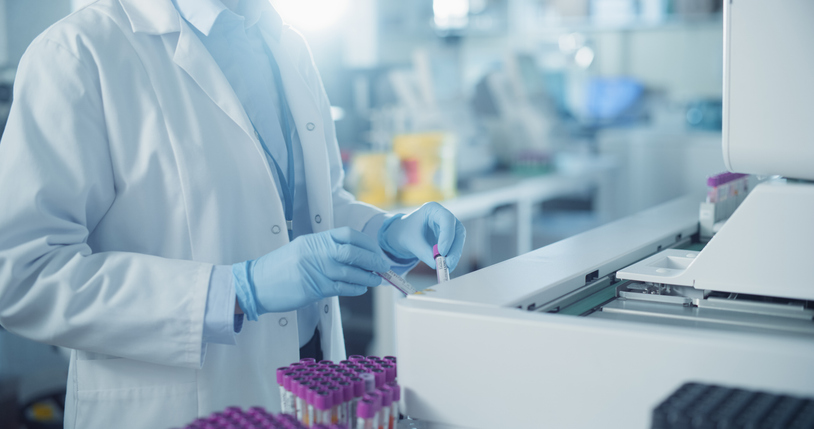 Skilled Laboratory Technician Operating Advanced Diagnostic Equipment, Processing Blood Samples. Close Up on Anonymous Female Scientist Working in a Sterile Environment in Modern Healthcare Facility Skilled Laboratory Technician Operating Advanced Diagnostic Equipment, Processing Blood Samples. Close Up on Anonymous Female Scientist Working in a Sterile Environment in Modern Healthcare Facility